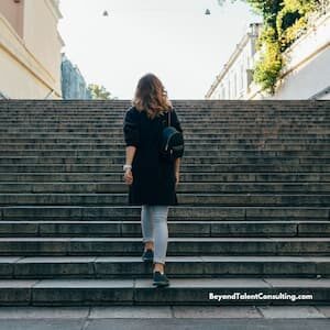 woman climbing steps to ikkustrate music career coaching as a process