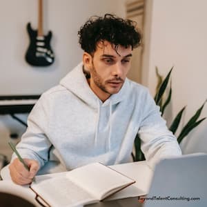 Man writing at a desk